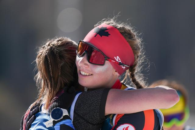(260308) -- TESERO, March 8, 2026 (Xinhua) -- Natalie Wilkie (R) of Canada celebrates after winning silver alongside sixth placed Brittany Hudak of Canada after the para biathlon women's sprint standing at the Milan-Cortina 2026 Paralympic Winter Games in Tesero, Italy, March 7, 2026. (Xinhua/Hou Zhaokang)