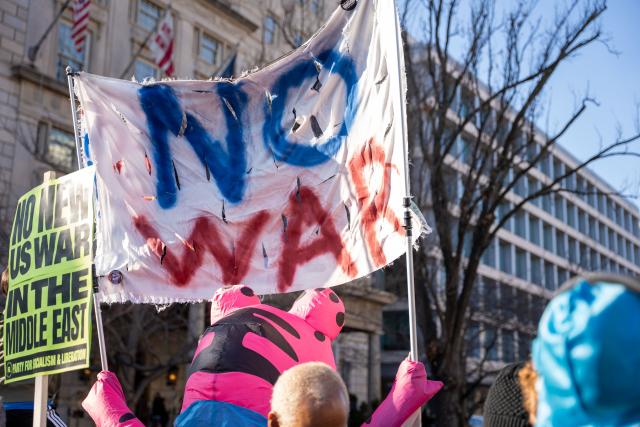 (260308) -- WASHINGTON, March 8, 2026 (Xinhua) -- People attend a rally against U.S.-Israeli attacks on Iran, in Washington, D.C., the United States, March 7, 2026. (Photo by Li Yuanqing/Xinhua)