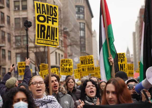 (260308) -- NEW YORK, March 8, 2026 (Xinhua) -- People attend a rally against U.S.-Israeli attacks on Iran, in New York, the United States, March 7, 2026. (Xinhua/Zhang Fengguo)