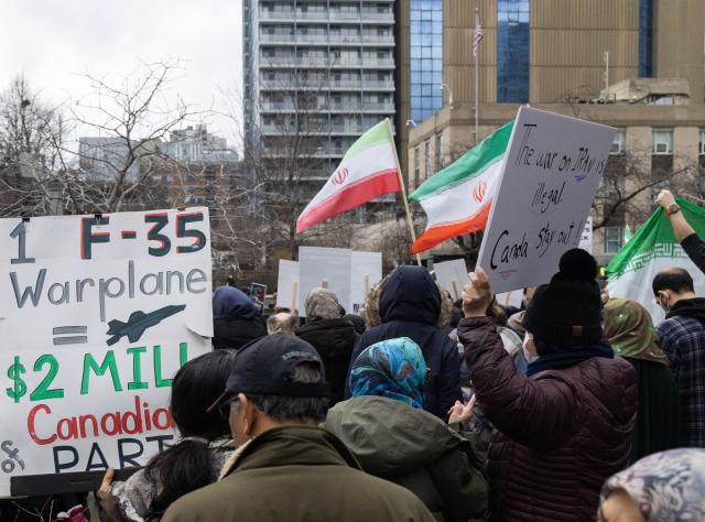 (260308) -- TORONTO, March 8, 2026 (Xinhua) -- People attend a rally against U.S.-Israeli attacks on Iran outside the U.S. Consulate General in Toronto, Canada, March 7, 2026. (Photo by Zou Zheng/Xinhua)