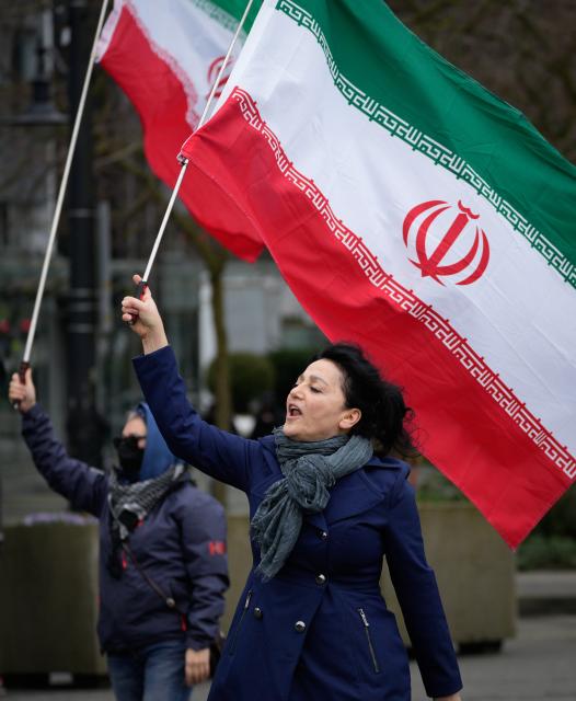 (260308) -- VANCOUVER, March 8, 2026 (Xinhua) -- People attend a rally against U.S.-Israeli attacks on Iran, in Vancouver, British Columbia, Canada, March 7, 2026. (Photo by Liang Sen/Xinhua)