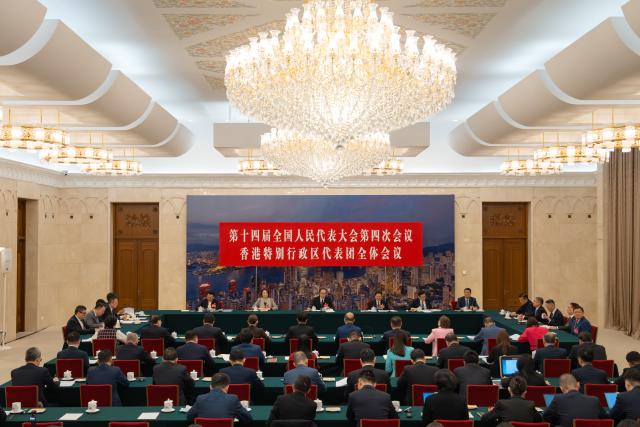 (260308) -- BEIJING, March 8, 2026 (Xinhua) -- A group meeting of deputies from the delegation of Hong Kong Special Administrative Region is held at the fourth session of the 14th National People's Congress (NPC) in Beijing, capital of China, March 8, 2026. (Xinhua/Li Minggang)