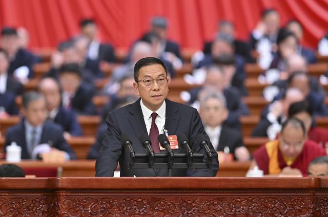 (260308) -- BEIJING, March 8, 2026 (Xinhua) -- Sze Wing-wai, a member of the 14th National Committee of the Chinese People's Political Consultative Conference (CPPCC), speaks at the third plenary meeting of the fourth session of the 14th CPPCC National Committee at the Great Hall of the People in Beijing, capital of China, March 8, 2026. (Xinhua/Yue Yuewei)