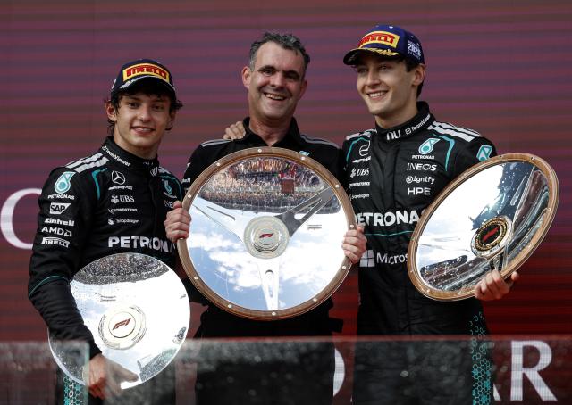 (260308) -- MELBOURNE, March 8, 2026 (Xinhua) -- Mercedes' Andrea Kimi Antonelli of Italy, Hywel Thomas, managing director of Mercedes AMG High Performance Powertrains and George Russell of Britain (L to R) pose for photo at the podium after the Formula One Australia Grand Prix at Albert Park in Melbourne, Australia, March 8, 2026. (Xinhua/Ma Ping)