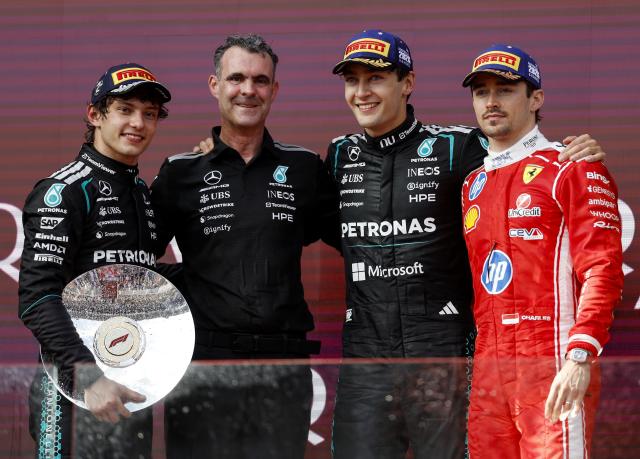 (260308) -- MELBOURNE, March 8, 2026 (Xinhua) -- Mercedes' Andrea Kimi Antonelli of Italy, Hywel Thomas, managing director of Mercedes AMG High Performance Powertrains, George Russell of Britain, and Ferrari's Charles Leclerc of Monaco (L to R) pose for photo at the podium after the Formula One Australia Grand Prix at Albert Park in Melbourne, Australia, March 8, 2026. (Xinhua/Ma Ping)