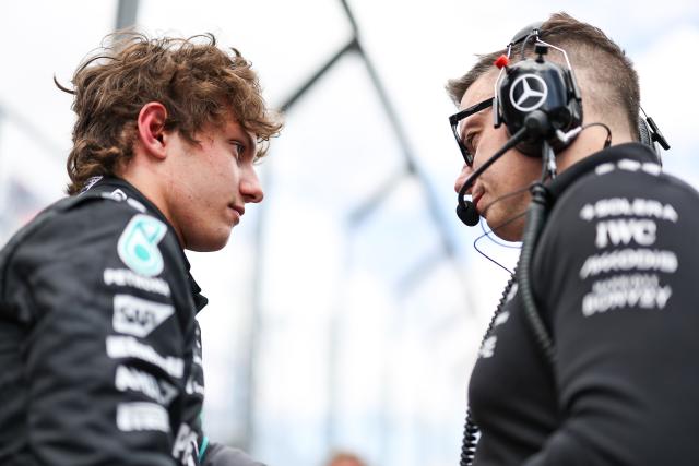 (260308) -- MELBOURNE, March 8, 2026 (Xinhua) -- Mercedes' Kimi Antonelli of Italy talks with his engineer on the grid before the Formula One Australia Grand Prix at Albert Park in Melbourne, Australia, March 8, 2026. (Photo by Qian Jun/Xinhua)