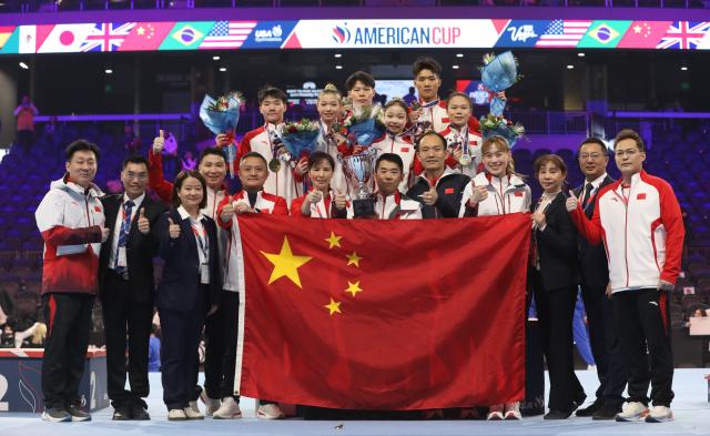 (260308) -- NEVADA, March 8, 2026 (Xinhua) -- Team China pose for photos after the awarding ceremony at the USA Gymnastics American Cup Mixed Team in Nevada, the United States, March 7, 2026. (Photo by Zeng Hui/Xinhua)