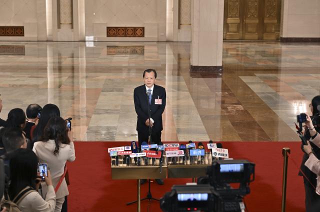 (260309) -- BEIJING, March 9, 2026 (Xinhua) -- Chinese Minister of Transport Liu Wei gives an interview after the second plenary meeting of the fourth session of the 14th National People's Congress (NPC) at the Great Hall of the People in Beijing, capital of China, March 9, 2026. (Xinhua/Li Xin)
