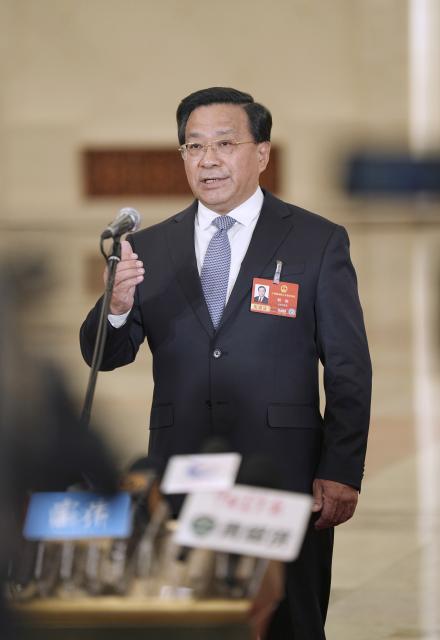 (260309) -- BEIJING, March 9, 2026 (Xinhua) -- Chinese Minister of Agriculture and Rural Affairs Han Jun gives an interview after the second plenary meeting of the fourth session of the 14th National People's Congress (NPC) at the Great Hall of the People in Beijing, capital of China, March 9, 2026. (Xinhua/Li Minggang)
