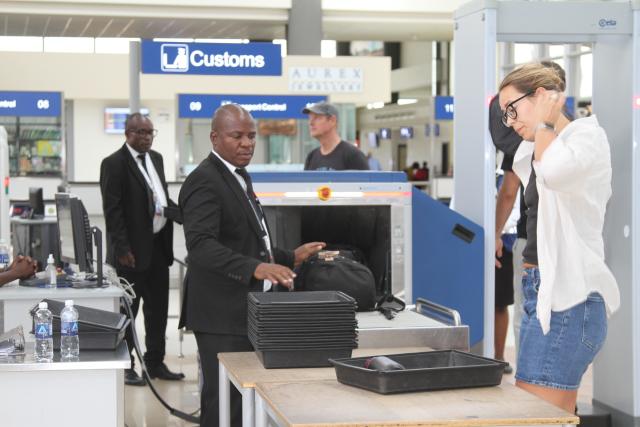 (260309) -- HARARE, March 9, 2026 (Xinhua) -- People go through customs at Robert Gabriel Mugabe International Airport in Harare, Zimbabwe, on March 5, 2026. The passenger throughput of Zimbabwe's Robert Gabriel Mugabe International Airport has recorded growth, especially following a China-financed expansion project commissioned in 2023, reaching about 1.65 million in 2025, according to the Airports Company of Zimbabwe (ACZ).
   TO GO WITH "China-financed airport expansion project boosts Zimbabwe's passenger flows" (Photo by Tafara Mugwara/Xinhua)