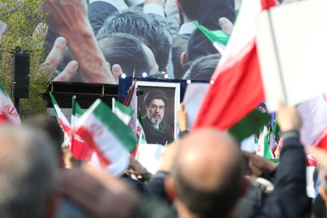 (260309) -- TEHRAN, March 9, 2026 (Xinhua) -- People attend gatherings to pledge allegiance to Iran's new Supreme Leader Mojtaba Khamenei at Enghelab Square in Tehran, Iran, on March 9, 2026. (Xinhua/Shadati)