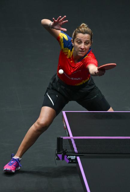 (260310) -- CHONGQING, March 10, 2026 (Xinhua) -- Elizabeta Samara of Romania hits a return during the women's singles round of 32 match against Kuai Man of China at the WTT Champions Chongqing 2026 in southwest China's Chongqing, March 10, 2026. (Xinhua/Chen Cheng)