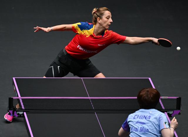 (260310) -- CHONGQING, March 10, 2026 (Xinhua) -- Elizabeta Samara of Romania hits a return during the women's singles round of 32 match against Kuai Man of China at the WTT Champions Chongqing 2026 in southwest China's Chongqing, March 10, 2026. (Xinhua/Chen Cheng)
