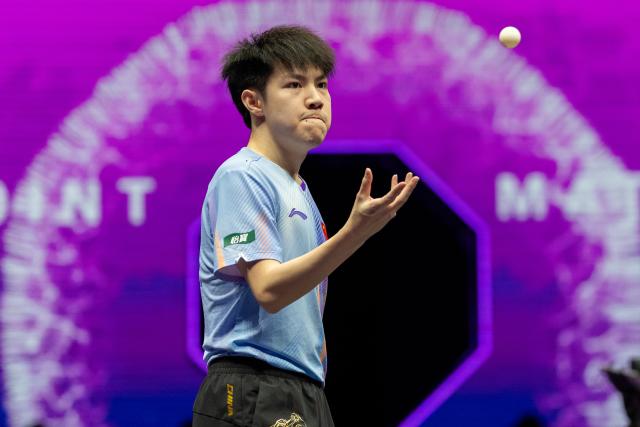 (260310) -- CHONGQING, March 10, 2026 (Xinhua) -- Huang Youzheng of China reacts during the men's singles round of 32 match against Zhou Qihao of China at the WTT Champions Chongqing 2026 in southwest China's Chongqing, March 10, 2026. (Xinhua/Huang Wei)
