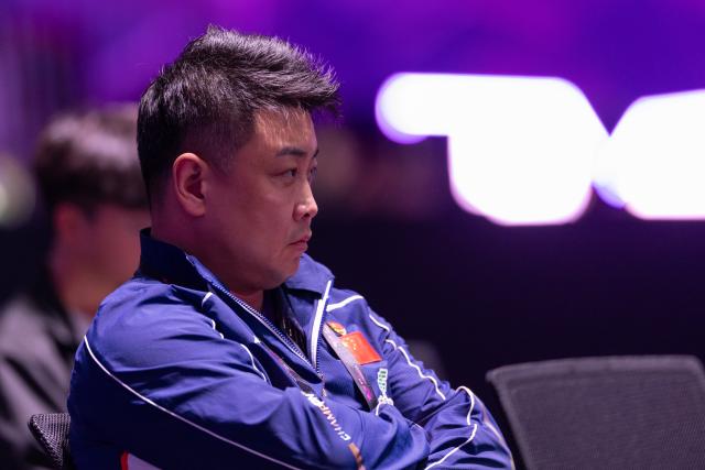 (260310) -- CHONGQING, March 10, 2026 (Xinhua) -- China's coach Wang Hao watches the match from the sidelines during the men's singles round of 32 match between Huang Youzheng of China and Zhou Qihao of China at the WTT Champions Chongqing 2026 in southwest China's Chongqing, March 10, 2026. (Xinhua/Huang Wei)