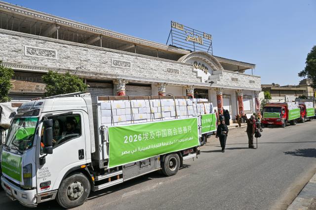 (260310) -- GIZA, March 10, 2026 (Xinhua) -- This photo taken on March 9, 2026 shows trucks loaded with boxes of donated items during a donation event in Giza, Egypt, March 9, 2026. The Chinese Chamber of Commerce in Egypt and the Egyptian Orman Association jointly held a donation event in Giza governorate on Monday to help Egyptian families in need.
   TO GO WITH "Chinese companies hold charity event in Egypt" (Xinhua/Xin Mengchen)