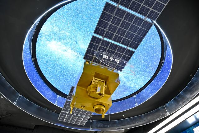 (260310) -- BEIJING, March 10, 2026 (Xinhua) -- This photo taken on July 1, 2025 shows a model of the quantum science satellite Mozi at the science and technology experience center of China Telecom Quantum Group in Hefei, east China's Anhui Province. (Xinhua/Zhang Cheng)