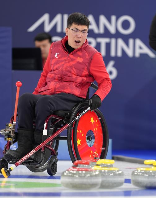 (260310) -- CORTINA D'AMPEZZO, March 10, 2026 (Xinhua) -- Chen Jianxin of China reacts during the wheelchair curling mixed team round robin session 7 match between China and Canada at the Milan-Cortina 2026 Paralympic Winter Games in Cortina D'ampezzo, Italy, March 10, 2026. (Xinhua/Cai Yang)