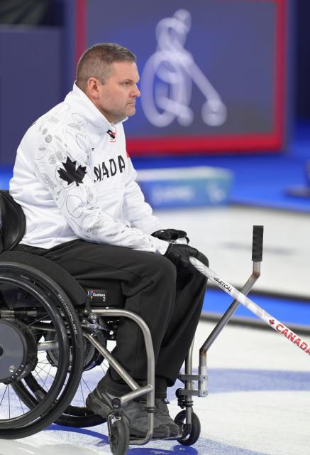 (260310) -- CORTINA D'AMPEZZO, March 10, 2026 (Xinhua) -- Mark Ideson of Canada reacts during the wheelchair curling mixed team round robin session 7 match between China and Canada at the Milan-Cortina 2026 Paralympic Winter Games in Cortina D'ampezzo, Italy, March 10, 2026. (Xinhua/Cai Yang)
