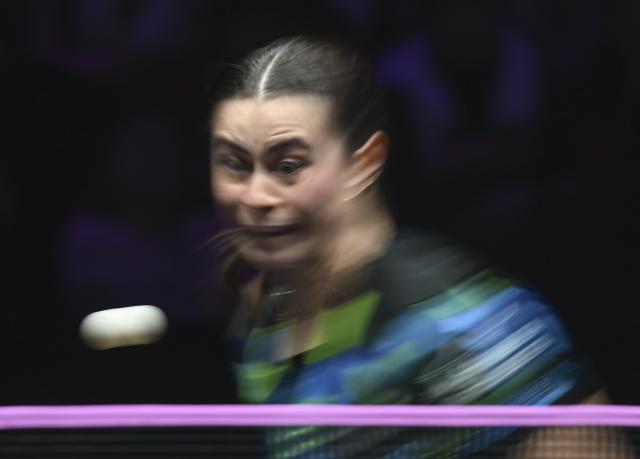 (260310) -- CHONGQING, March 10, 2026 (Xinhua) -- Bruna Takahashi of Brazil hits a return during the women's singles round of 32 match against Zeng Jian of Singapore at the WTT Champions Chongqing 2026 in southwest China's Chongqing, March 10, 2026. (Xinhua/Chen Cheng)