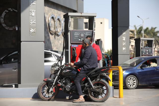 (260310) -- CAIRO, March 10, 2026 (Xinhua) -- People refuel their vehicles at a gas station in Cairo, Egypt, on March 10, 2026. TO GO WITH "Egypt raises fuel prices amid global energy market pressures" (Xinhua/Ahmed Gomaa)