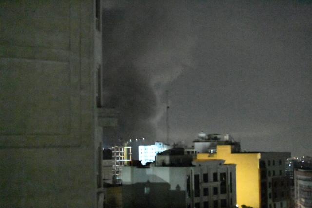 (260310) -- TEHRAN, March 10, 2026 (Xinhua) -- Thick smoke rises from buildings following airstrikes in Tehran, Iran, on March 10, 2026. (Xinhua/Shadati)