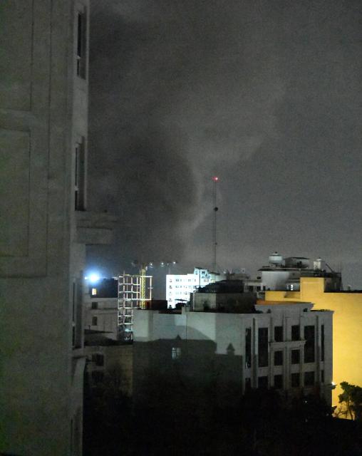 (260310) -- TEHRAN, March 10, 2026 (Xinhua) -- Thick smoke rises from buildings following airstrikes in Tehran, Iran, on March 10, 2026. (Xinhua/Shadati)