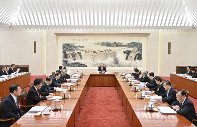 (260310) -- BEIJING, March 10, 2026 (Xinhua) -- Zhao Leji, executive chairman of the presidium of the fourth session of the 14th National People's Congress (NPC) and chairman of the NPC Standing Committee, presides over the first meeting of executive chairpersons of the presidium at the Great Hall of the People in Beijing, capital of China, March 10, 2026. (Xinhua/Yin Bogu)