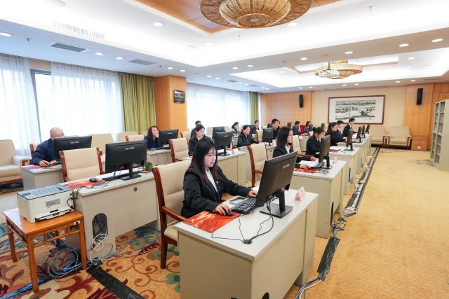 (260310) -- BEIJING, March 10, 2026 (Xinhua) -- Staff work at the secretariat of the fourth session of the 14th National People's Congress (NPC) in Beijing, capital of China, March 10, 2026. Chinese national lawmakers submitted 226 proposals to the country's annual legislative session as of Sunday noon, the deadline for proposal submission at the ongoing fourth session of the 14th NPC.
   The secretariat of the session said that it had also received over 7,000 suggestions from NPC deputies. (Xinhua/Wang Xi)