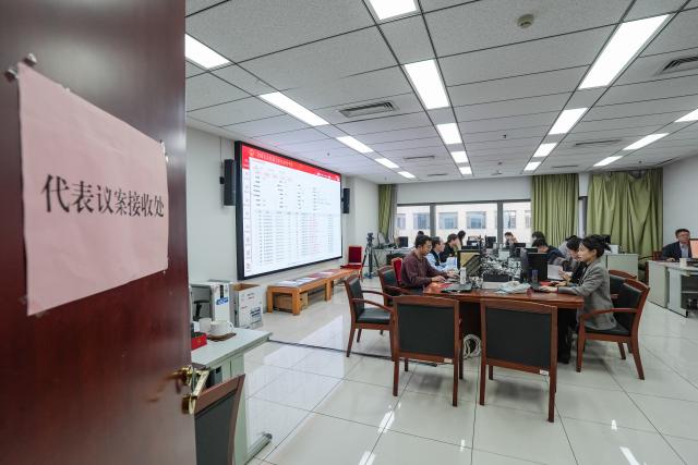 (260310) -- BEIJING, March 10, 2026 (Xinhua) -- Staff work at the secretariat of the fourth session of the 14th National People's Congress (NPC) in Beijing, capital of China, March 10, 2026. Chinese national lawmakers submitted 226 proposals to the country's annual legislative session as of Sunday noon, the deadline for proposal submission at the ongoing fourth session of the 14th NPC.
   The secretariat of the session said that it had also received over 7,000 suggestions from NPC deputies. (Xinhua/Wang Xi)