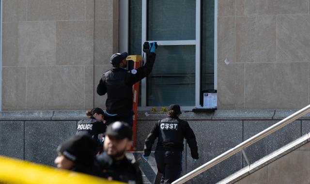 (260310) -- TORONTO, March 10, 2026 (Xinhua) -- Toronto police work at the scene of a shooting incident in Toronto, Canada, on March 10, 2026. Toronto police said Tuesday they are investigating a shooting incident targeting the U.S. consulate in the largest city in Canada. No injuries were reported, police said, adding that they did not have information on a suspect. (Photo by Li Haitao/Xinhua)