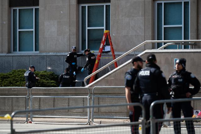 (260310) -- TORONTO, March 10, 2026 (Xinhua) -- Toronto police work at the scene of a shooting incident in Toronto, Canada, on March 10, 2026. Toronto police said Tuesday they are investigating a shooting incident targeting the U.S. consulate in the largest city in Canada. No injuries were reported, police said, adding that they did not have information on a suspect. (Photo by Li Haitao/Xinhua)