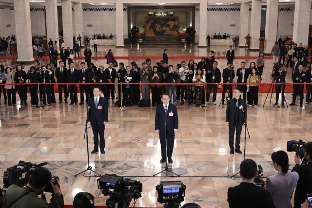 (260311) -- BEIJING, March 11, 2026 (Xinhua) -- Members of the 14th National Committee of the Chinese People's Political Consultative Conference (CPPCC) attend a group interview ahead of the closing meeting of the fourth session of the 14th CPPCC National Committee at the Great Hall of the People in Beijing, capital of China, March 11, 2026. (Xinhua/Cao Yiming)