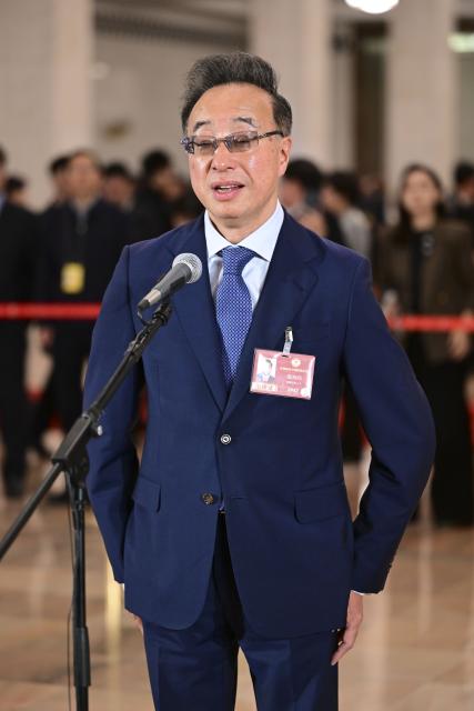 (260311) -- BEIJING, March 11, 2026 (Xinhua) -- Tu Haiming, a member of the 14th National Committee of the Chinese People's Political Consultative Conference (CPPCC), attends a group interview ahead of the closing meeting of the fourth session of the 14th CPPCC National Committee at the Great Hall of the People in Beijing, capital of China, March 11, 2026. (Xinhua/Chen Yehua)