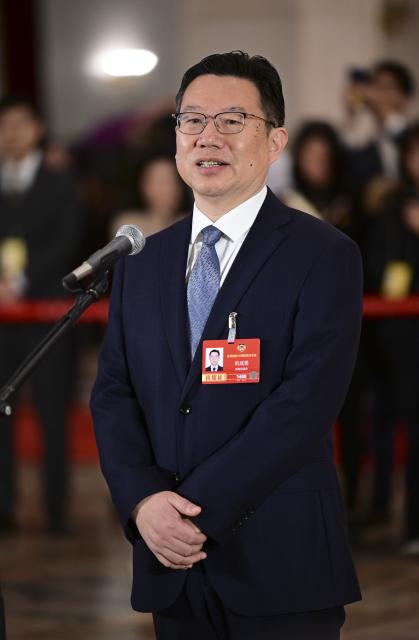 (260311) -- BEIJING, March 11, 2026 (Xinhua) -- Liu Chengyong, a member of the 14th National Committee of the Chinese People's Political Consultative Conference (CPPCC), attends a group interview ahead of the closing meeting of the fourth session of the 14th CPPCC National Committee at the Great Hall of the People in Beijing, capital of China, March 11, 2026. (Xinhua/Chen Yehua)