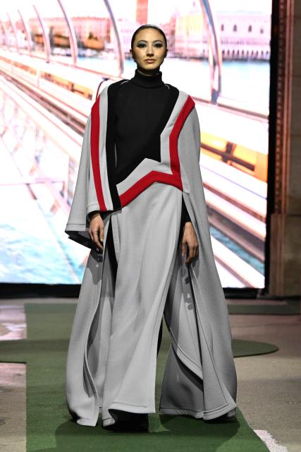 (260311) -- PARIS, March 11, 2026 (Xinhua) -- A model presents a creation from the Ready-to-Wear Fall/Winter 2026-2027 collections by Pierre Cardin during the Paris Fashion Week in Paris, France, on March 10, 2026. (MeetEurope/Handout via Xinhua)