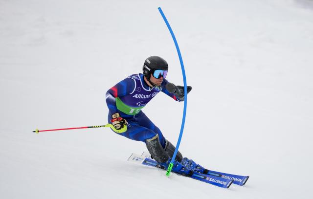(260311) -- CORTINA D'AMPEZZO, March 11, 2026 (Xinhua) -- Oscar Burnham of France competes during the Para Alpine Skiing Men's Alpine Combined Standing event at the Milan-Cortina 2026 Paralympic Winter Games in Cortina D'ampezzo, Italy, March 10, 2026. (Xinhua/Wang Kaiyan)