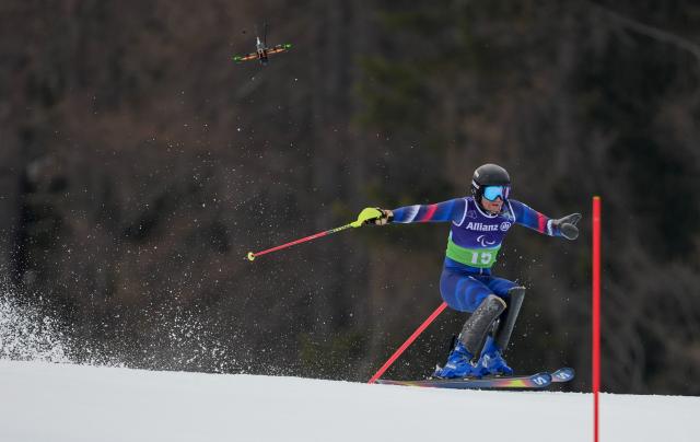 (260311) -- CORTINA D'AMPEZZO, March 11, 2026 (Xinhua) -- Oscar Burnham of France competes during the Para Alpine Skiing Men's Alpine Combined Standing event at the Milan-Cortina 2026 Paralympic Winter Games in Cortina D'ampezzo, Italy, March 10, 2026. (Xinhua/Wang Kaiyan)