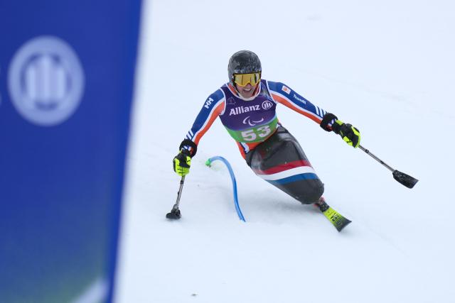 (260311) -- CORTINA D'AMPEZZO, March 11, 2026 (Xinhua) -- Niels de Langen of the Netherlands competes during the Para Alpine Skiing Men's Alpine Combined Sitting event at the Milan-Cortina 2026 Paralympic Winter Games in Cortina D'ampezzo, Italy, March 10, 2026. (Xinhua/Lian Yi)