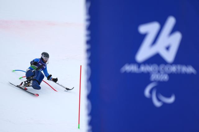 (260311) -- CORTINA D'AMPEZZO, March 11, 2026 (Xinhua) -- Rene de Silvestro of Italy competes during the Para Alpine Skiing Men's Alpine Combined Sitting event at the Milan-Cortina 2026 Paralympic Winter Games in Cortina D'ampezzo, Italy, March 10, 2026. (Xinhua/Lian Yi)