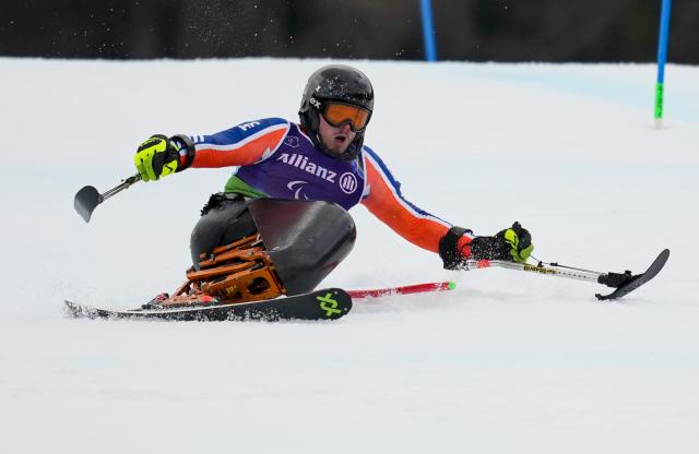 (260311) -- CORTINA D'AMPEZZO, March 11, 2026 (Xinhua) -- Jeroen Kampschreur of the Netherlands competes during the Para Alpine Skiing Men's Alpine Combined Sitting event at the Milan-Cortina 2026 Paralympic Winter Games in Cortina D'ampezzo, Italy, March 10, 2026. (Xinhua/Wang Kaiyan)