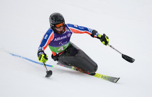 (260311) -- CORTINA D'AMPEZZO, March 11, 2026 (Xinhua) -- Jeroen Kampschreur of the Netherlands competes during the Para Alpine Skiing Men's Alpine Combined Sitting event at the Milan-Cortina 2026 Paralympic Winter Games in Cortina D'ampezzo, Italy, March 10, 2026. (Xinhua/Wang Kaiyan)
