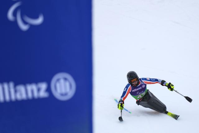 (260311) -- CORTINA D'AMPEZZO, March 11, 2026 (Xinhua) -- Jeroen Kampschreur of the Netherlands competes during the Para Alpine Skiing Men's Alpine Combined Sitting event at the Milan-Cortina 2026 Paralympic Winter Games in Cortina D'ampezzo, Italy, March 10, 2026. (Xinhua/Lian Yi)