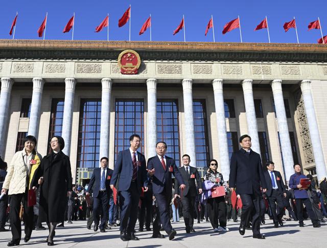 (260311) -- BEIJING, March 11, 2026 (Xinhua) -- Members of the 14th National Committee of the Chinese People's Political Consultative Conference (CPPCC) leave the Great Hall of the People after the closing meeting of the fourth session of the 14th CPPCC National Committee in Beijing, capital of China, March 11, 2026. (Xinhua/Jin Liangkuai)