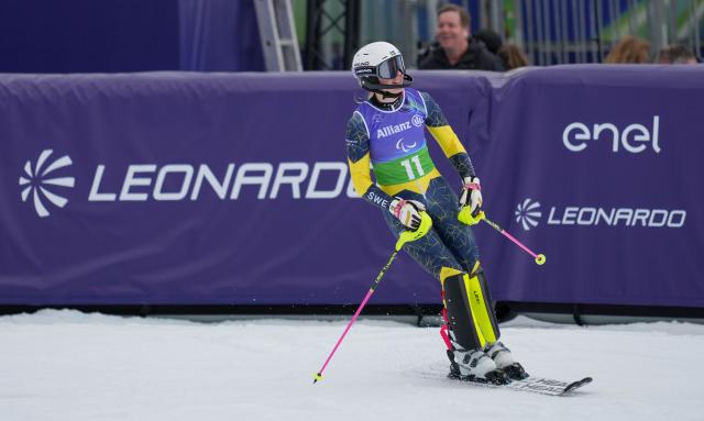 (260311) -- CORTINA D'AMPEZZO, March 11, 2026 (Xinhua) -- Ebba Aarsjoe of Sweden celebrates after winning the para alpine skiing women's combined standing event at the Milan-Cortina 2026 Paralympic Winter Games in Cortina D'ampezzo, Italy, March 10, 2026. (Xinhua/Wang Kaiyan)