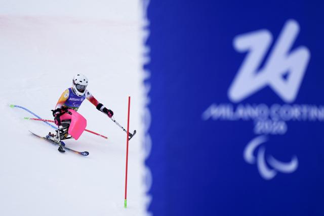 (260311) -- CORTINA D'AMPEZZO, March 11, 2026 (Xinhua) -- Audrey Pascual Seco of Spain competes during the para alpine skiing women's combined sitting event at the Milan-Cortina 2026 Paralympic Winter Games in Cortina D'ampezzo, Italy, March 10, 2026. (Xinhua/Lian Yi)