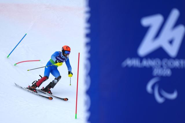 (260311) -- CORTINA D'AMPEZZO, March 11, 2026 (Xinhua) -- Giacomo Bertagnolli of Italy competes during the Para Alpine Skiing Men's Alpine Combined Vision Impaired event at the Milan-Cortina 2026 Paralympic Winter Games in Cortina D'ampezzo, Italy, March 10, 2026. (Xinhua/Lian Yi)