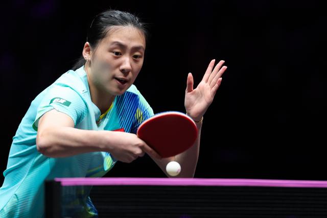 (260311) -- CHONGQING, March 11, 2026 (Xinhua) -- Chen Yi hits a return during the women's singles round of 32 match between Chen Yi of China and Kim Nayeong of South Korea at the WTT Champions Chongqing 2026 in southwest China's Chongqing, March 11, 2026. (Xinhua/Huang Wei)