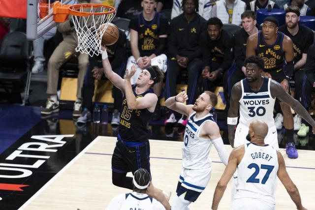 (260311) -- LOS ANGELES, March 11, 2026 (Xinhua) -- Los Angeles Lakers' Austin Reaves (L) drives to the basket for a layup during the 2025-2026 NBA regular season game between Los Angeles Lakers and Minnesota Timberwolves in Los Angeles, the United States, March 10, 2026. (Photo by Ringo Chiu/Xinhua)