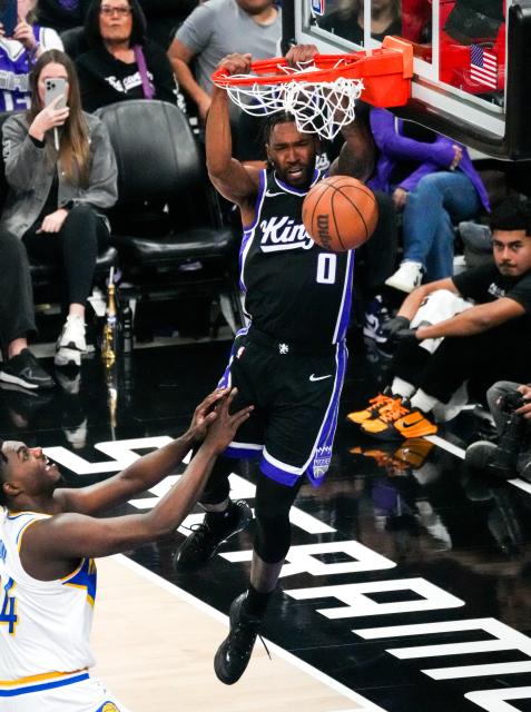 (260311) -- SACRAMENTO, March 11, 2026 (Xinhua) -- Malik Monk (R) of Sacramento Kings dunks during the 2025-2026 NBA regular season game between Sacramento Kings and Indiana Pacers in Sacramento, the United States, March 10, 2026. (Photo by Sun Yuxuan/Xinhua)